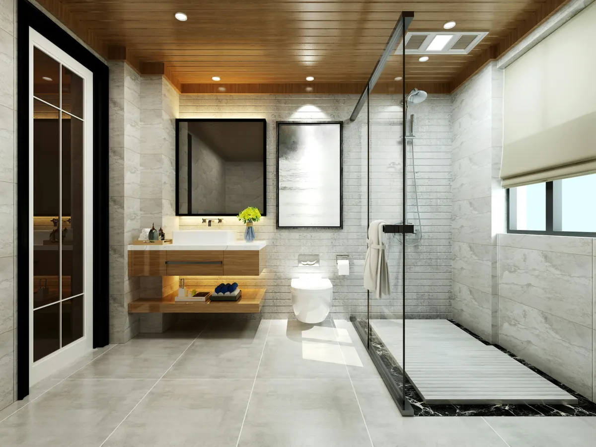 Stunning marble bath floor tile as we as wall tiles with a glassed walkin shower that is accessed without a door.